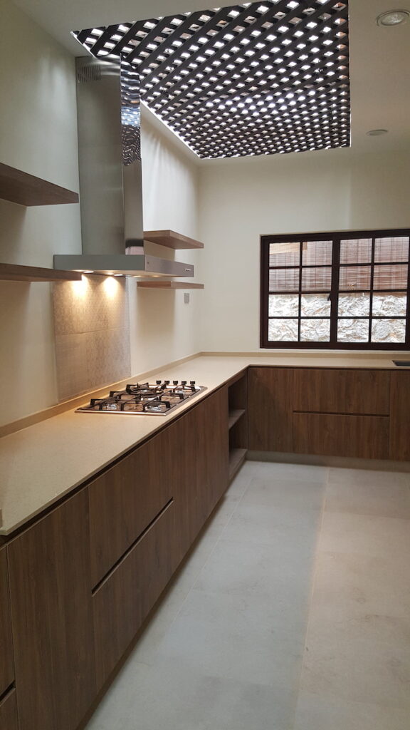 landed kitchen with brown cabinets 3